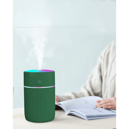 Image of KHAAS Car Humidifier, showing the product in green color indoors. 
