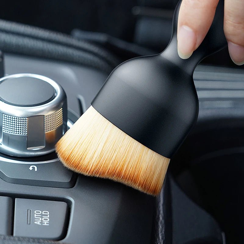 Image of KHAAS Car Interior Detailing Brush, showing the product detailing the center console 