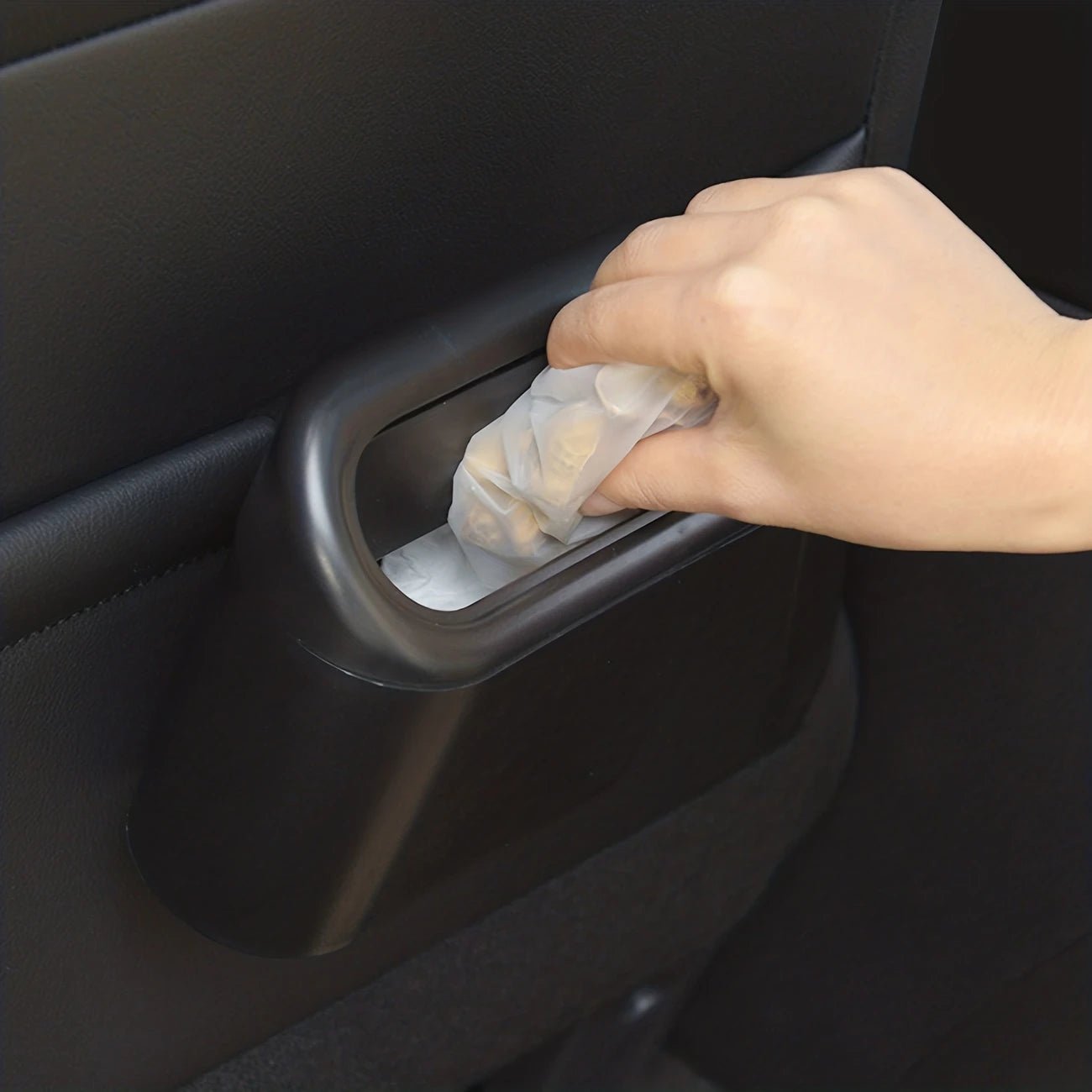 Image of KHAAS Trash Can for Car with Lid, showing the product being used as it's intended. 