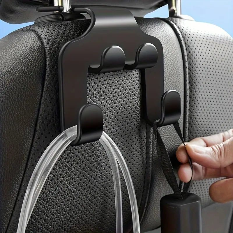 Image of KHAAS Headrest Hooks for Cars, showing the items hanging off the hook 