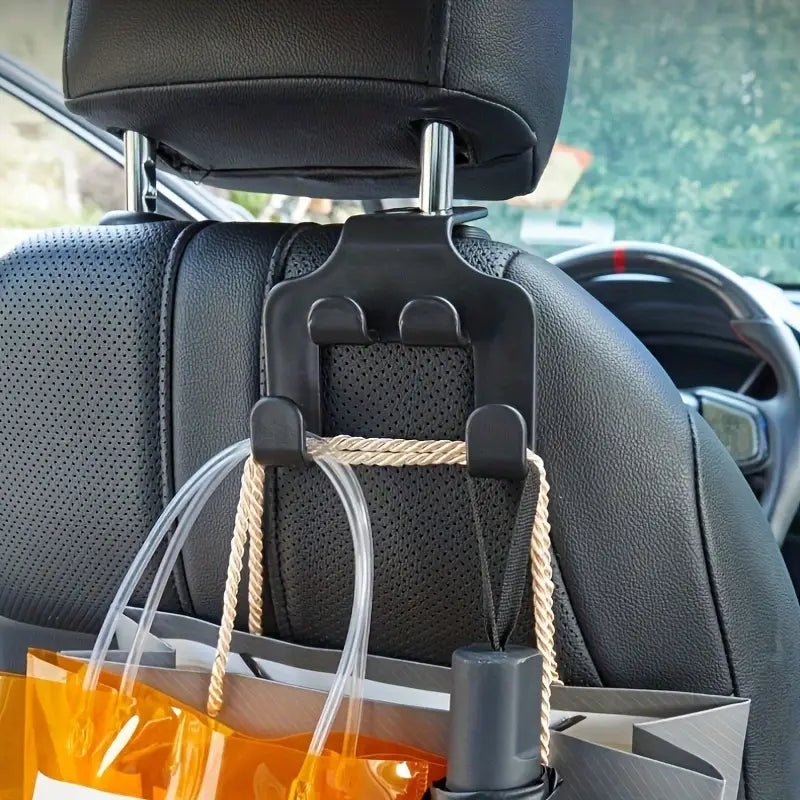 Image of KHAAS Headrest Hooks for Cars, showing items being hung off of the product 